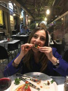 Jenna eating pizza